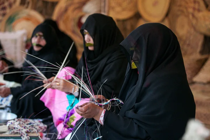 Emirati craft makers working at House of Artisans, Abu Dhabi